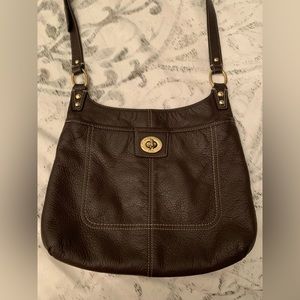 Coach purse in gorgeous brown leather. Gently used condition. Variety of pockets